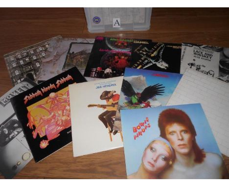 A box of approximately 90 progressive rock LP records including Led Zeppelin, Budgie, Jimi Hendrix, The Beatles, Camel, Pink 