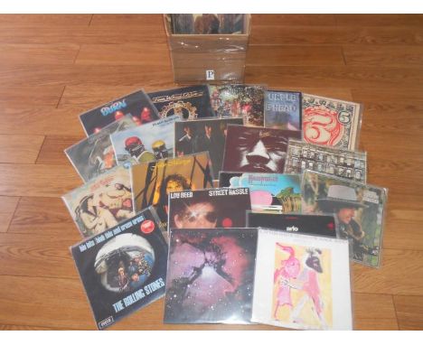 A box of approximately 60 progressive and classic rock LP records including King Crimson, Jimi Hendrix, Captain Beefheart, Bl