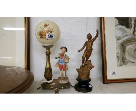 A French spelter figure & a spelter lamp with bisque flower seller figurine