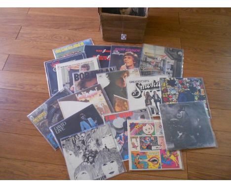 A box of apporximately 60 rock and folk LP records including The Beatles, The Who, David Bowie, Black Sabbath, Hawkwind, Bob 