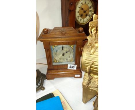 A oak cased striking mantel clock by John Piggott Ltd, Cheapside & milk St E.C