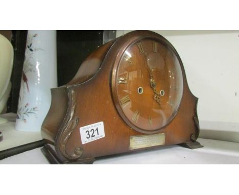 A Smith's mantel clock with silver presentation plaque