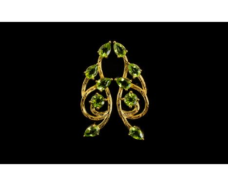 Peridot Art Nouveau Style Drop Earrings, each earring having four pear cut and one round cut peridot, an overall total of 4.7