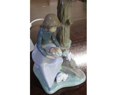 Nao table lamp modelled as girl with three rabbits seated by a tree, with shade H34cm 