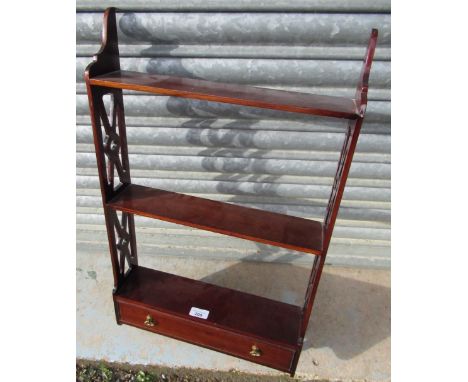 Regency style mahogany single drawer three tier wall shelf with pierced sides, H69cm W41cm D10cm 