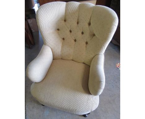 Victorian style upholstered armchair with deep button wing back and scroll arms on cabriole legs 