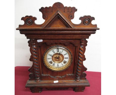 Early 20th C Ansonia "Newby" mantel clock, carved oak case with barley twist columns, two train movement striking on a gong, 