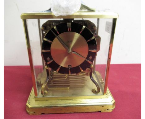 Mid 20th C Schatz mantel clock lacquered brass case  with four glazed panels on platform base, three train triple chiming mov
