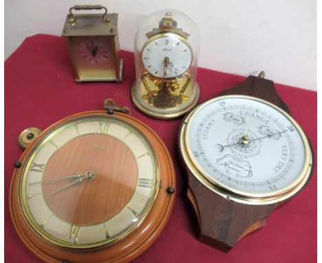 Kundo 400 day torsion bar clock under glass dome, a lacquered glass quartz carriage clock, a Kienzle wall clock and a Shortla