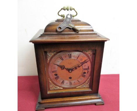 20th C Georgian style cased bracket clock with silvered chapter, three train triple chiming movement with floating suspension