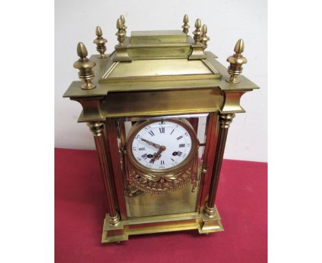 Early 20th C French four glass mantel clock, gilt brass architectural case enclosing four bevel edged glazed panels, white en