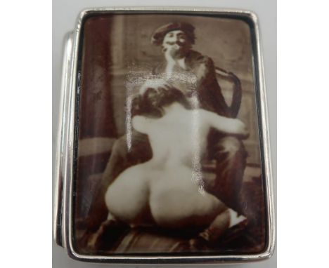 Silver and enamel pill box depicting erotic scene, stamped Sterling 