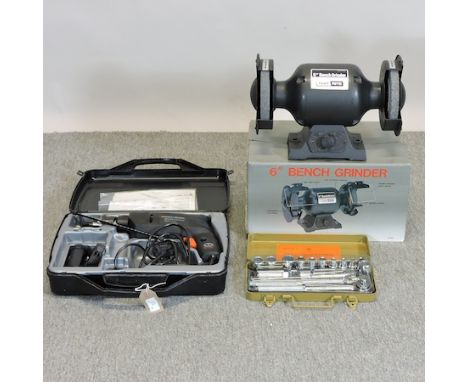 A bench grinder, boxed, together with a Black and Decker electric drill and a socket set