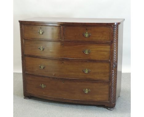 A 19th century mahogany bow front chest of drawers, flanked by spirally turned columns, 120cm