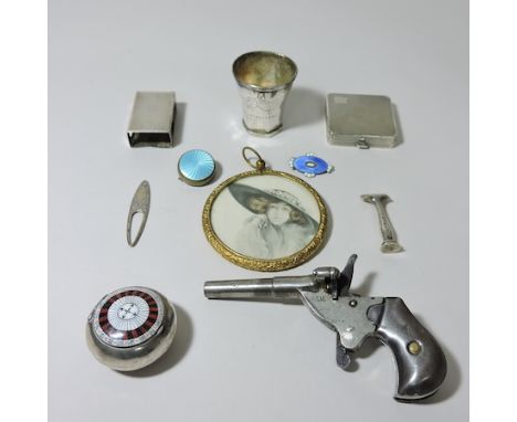 A silver box, enamelled in the design of a roulette wheel, 4cm diameter, together with a silver compact, a continental silver