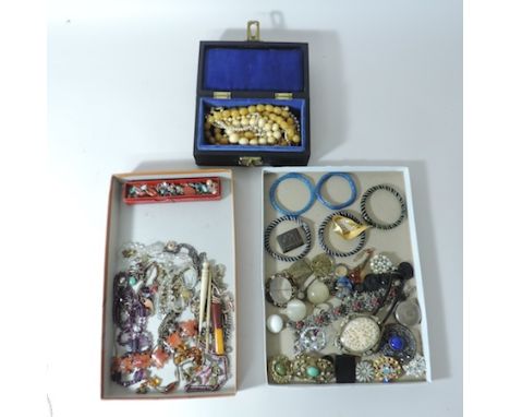 Two boxes of 19th century and later costume jewellery, to include a Canton carved ivory brooch, glass bangle, bead necklaces 