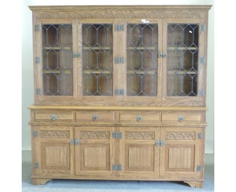 An Old Charm light oak bookcase, with a lead glazed upper section and doors below, 188cm