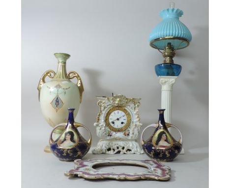 A 19th century French porcelain cased mantel clock, 19cm tall, together with a near pair of Austrian vases, a pottery oil lam