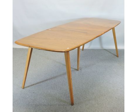 An Ercol light elm extending dining table, with two additional leaves, 226 x 80cm overall