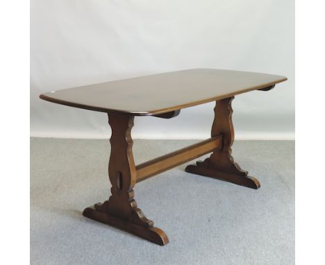 An Ercol dark elm dining table, 150 x 75cm