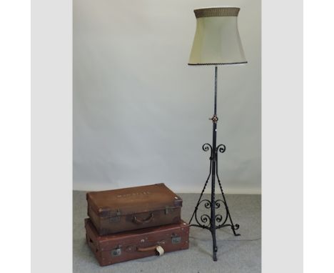 A black wrought iron standard lamp and shade, together with two vintage suitcases, largest 73cm