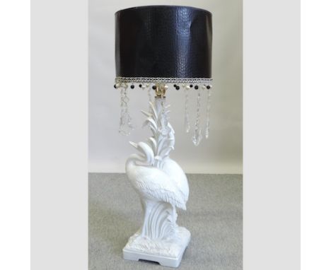 A white painted pottery table lamp in the form of two herons, with a pair of lamp shades, 90cm tall overall 