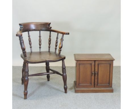 An elm smoker's bow, together with a small mahogany two door cabinet, 47cm