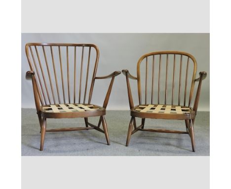 A pair of Ercol spindle back arm chairs