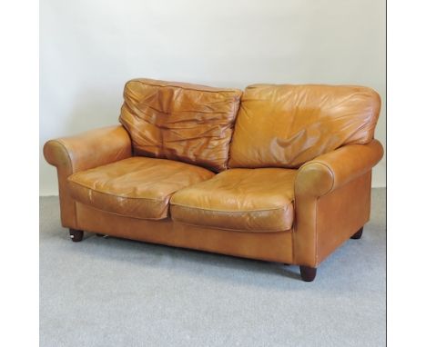 A modern brown leather upholstered two seater sofa, 173cm