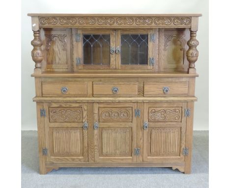 An Old Charm light oak court cupboard, with lead glazed doors, 137cm 