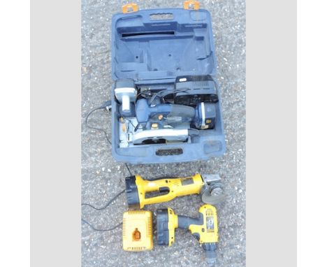 A battery powered circular saw, together with a De Walt angle grinder and a drill 