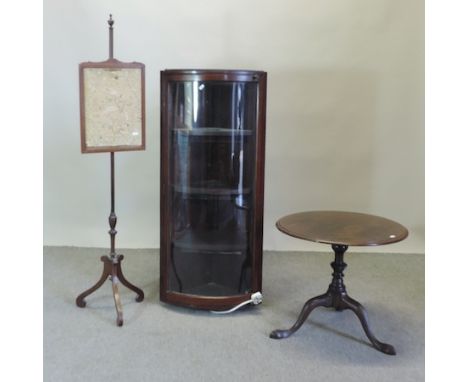 A 19th century mahogany glazed bow front hanging corner cabinet, 52cm, together with a Regency pole screen and a tripod table