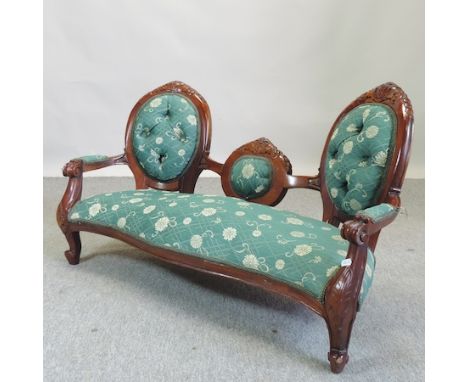 A Victorian style carved walnut and green upholstered dolls sofa, 97cm  