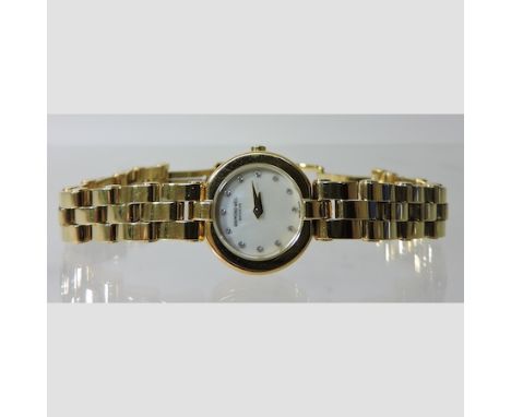 A Raymond Weil gold plated ladies wristwatch, with a diamond set mother of pearl dial and spare link 