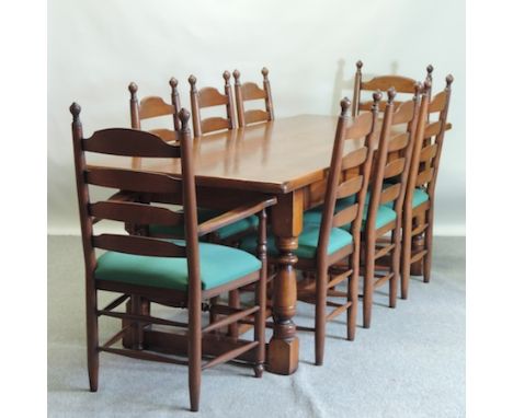 An oak refectory table, on turned legs, united by an H shaped stretcher, 220 x 86cm, together with a set of eight ladder back