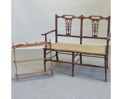 An Edwardian beech chair back sofa, with a padded seat, 105cm, together with a wall shelf
