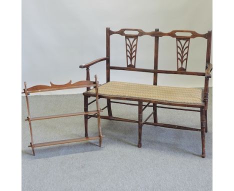 An Edwardian beech chair back sofa, with a padded seat, 105cm, together with a wall shelf