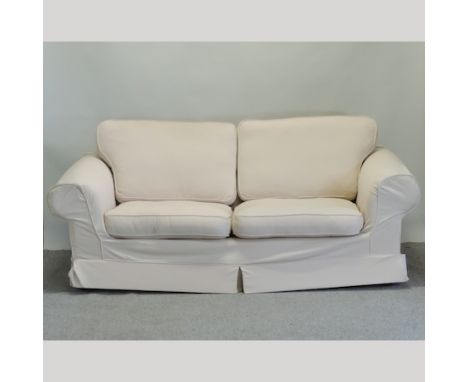 A modern cream upholstered two seater sofa, 225cm