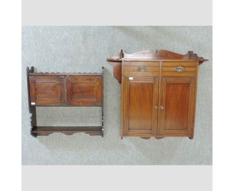 A Victorian walnut three tier wall shelf, together with another, 72cm