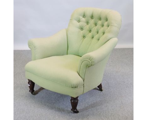 A Victorian green upholstered button back arm chair