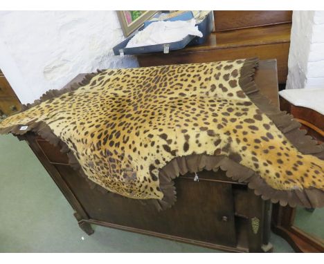 LEOPARD SKIN RUG, label to rear states; Mounted by Army and Navy C S Ltd Victorian Street London
