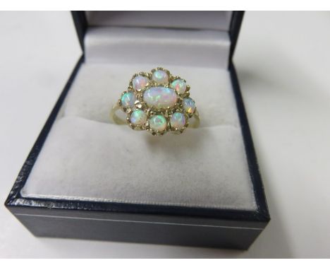 OPAL RING, 9ct yellow gold ring set a cluster of 9 opals, size N