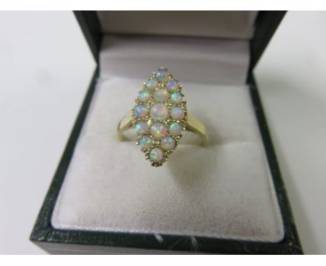 OPAL RING, 9ct yellow gold ring set a cluster of opals in a lozenge form mount, size M