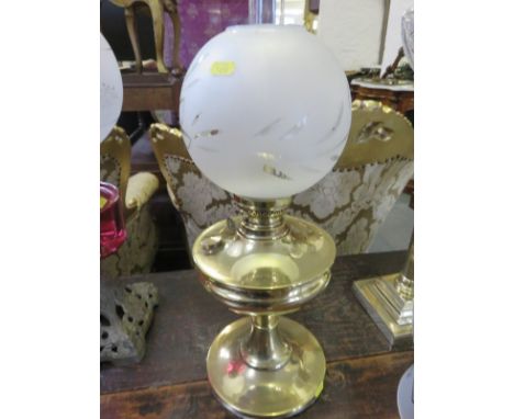 BRASS OIL LAMP, a brass based circular formed oil lamp with opaque glass shade, 21" high