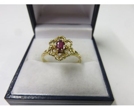 RUBY RING, 18ct yellow gold ruby and diamond cluster ring, size R/S