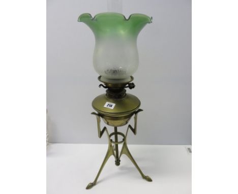 ARTS NOUVEAU OIL LAMP, brass tripod base oil lamp with green frosted glass crinoline shade 