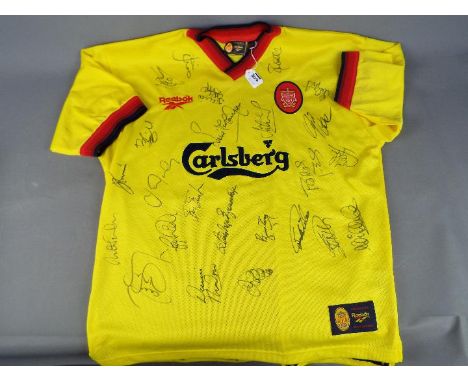 A Liverpool Football Club signed replica shirt from the 1997 - 1998 season bearing 24 signatures including Stig Inge Bjornbye