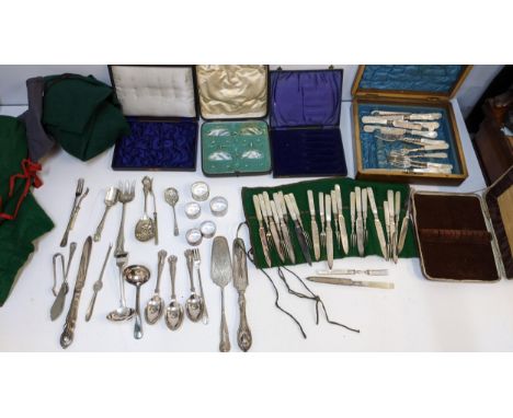 Silver plated cutlery and flatware to include two sets of mother of pearl handled dessert knives and forks, napkin rings, cak
