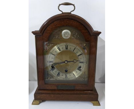 A 1960's Elliott 8-day lever mahogany mantel clock having a brass dial with cherub spandrels, striking on four rods, 37cm h x