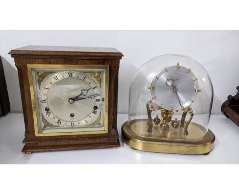 Two clocks to include an Elliott 8-day mantel clock, the dial signed William Bruford & Son Ltd, together with a Kundo anniver